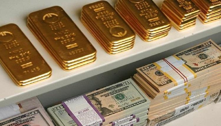 ارتفاع الدولار يوقف موجة الصعود القياسي للذهب
