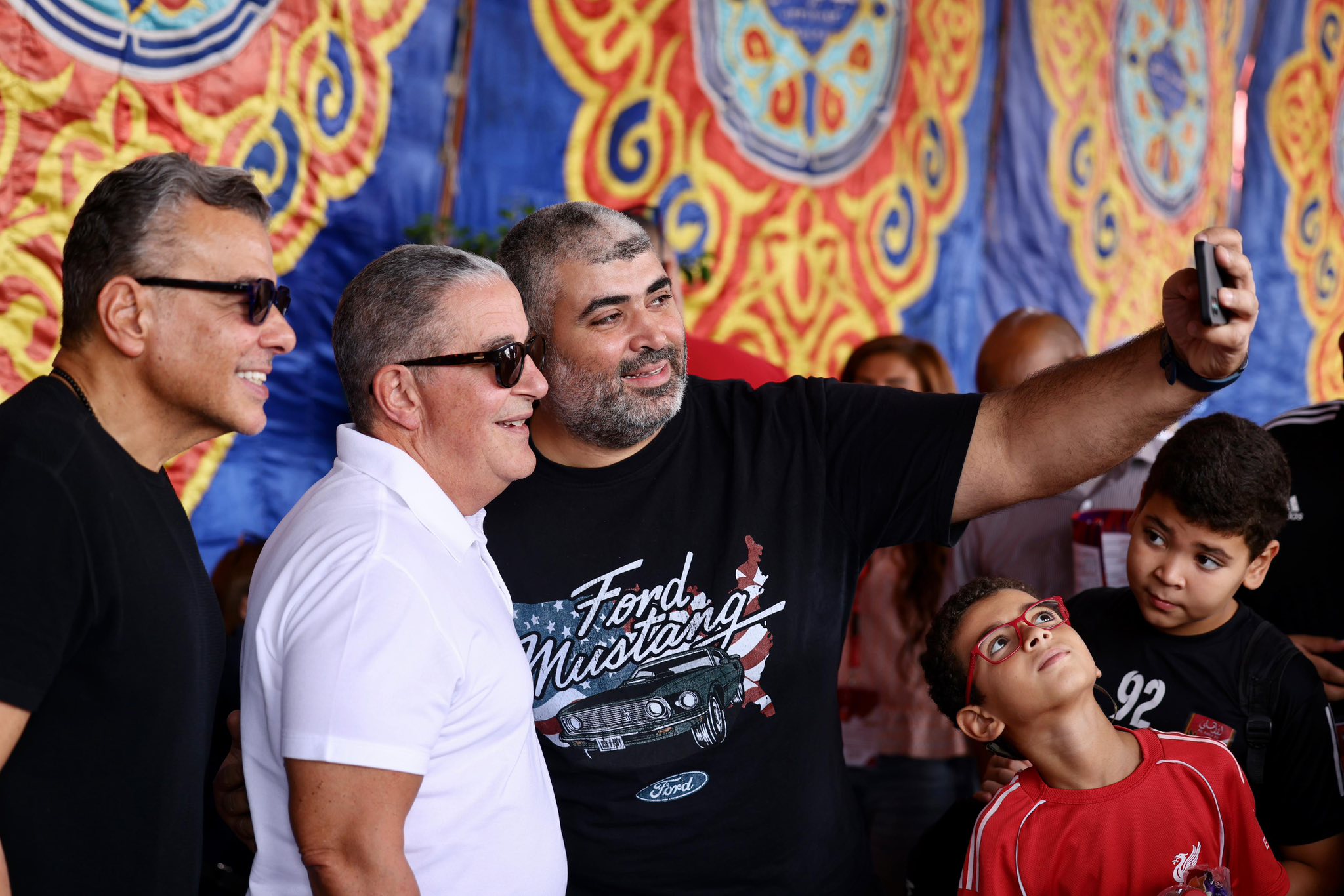 May be an image of one or more people, crowd and text that says 'Must Micstang Toung Ford か堂 Sord ፖር 92'