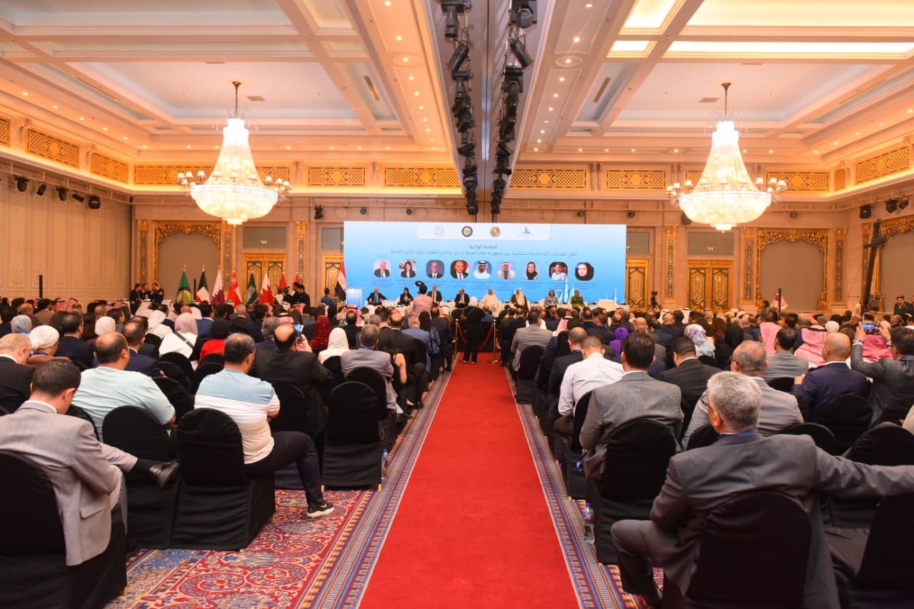 May be an image of lighting, dais, crowd and text