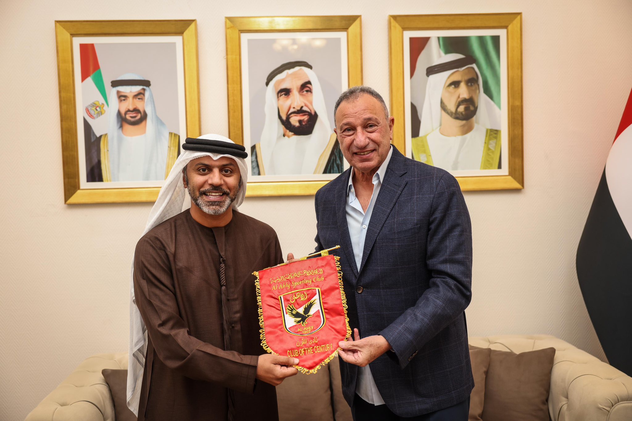 May be an image of one or more people and text