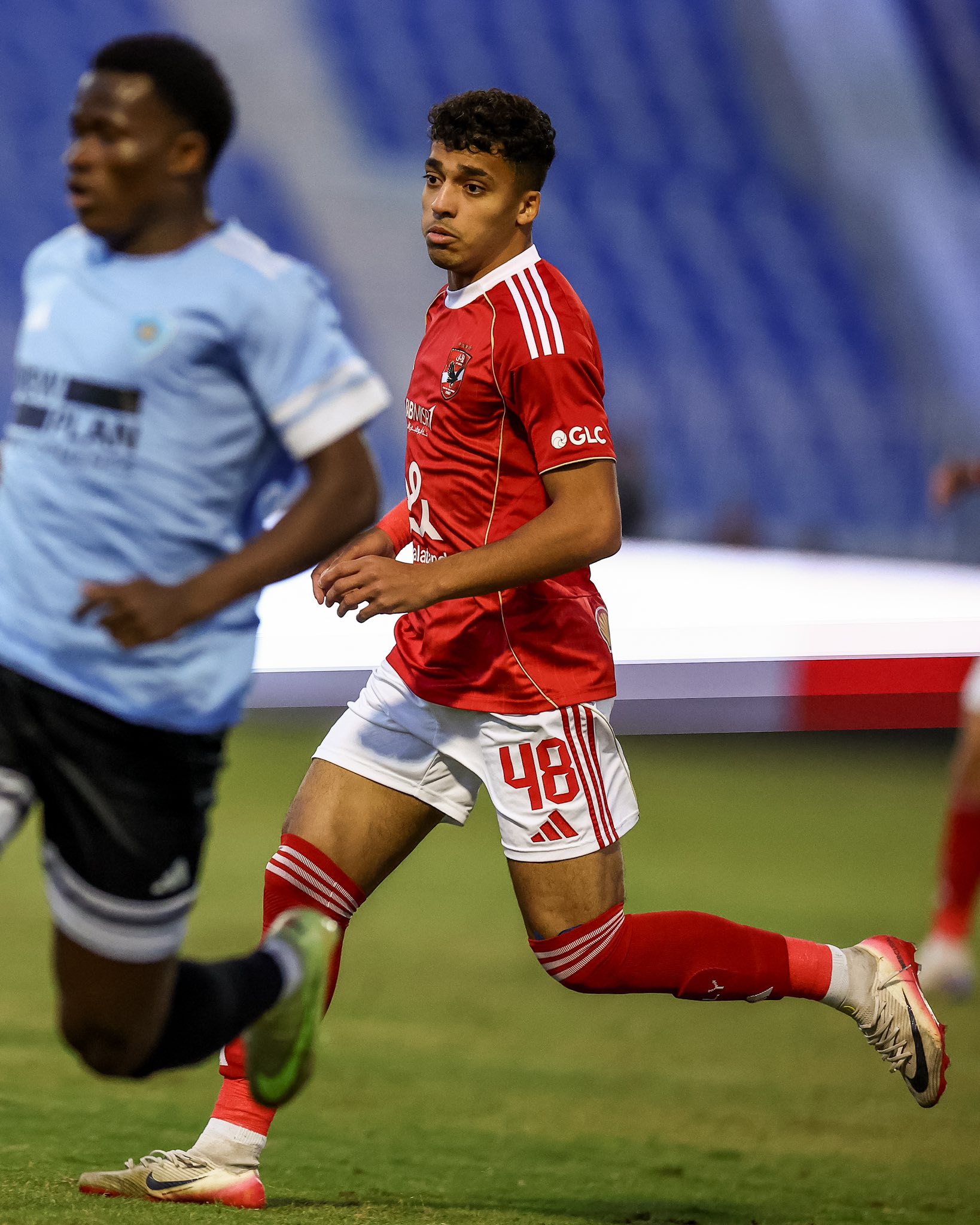 May be an image of football, American football and text